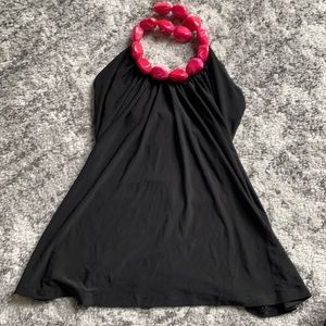 Black halter top with pink bead neckline. New.